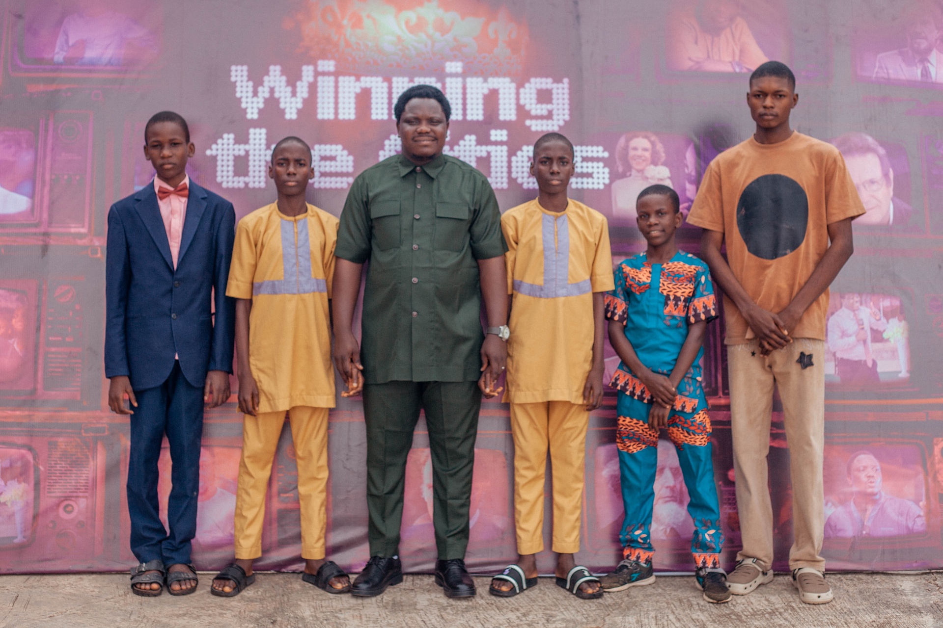 Pastor Ibukun Ali with attendees at the photo wall